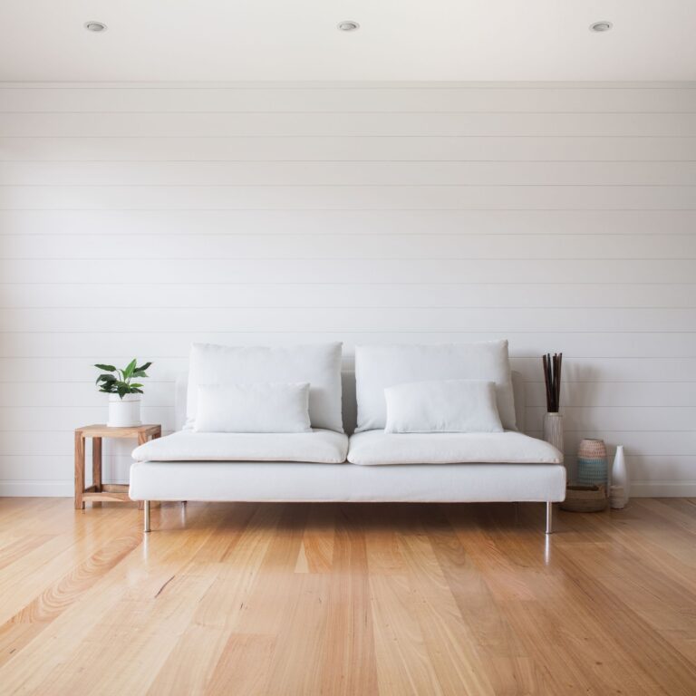Lighting Tips - white stylish couch in a spacious living area