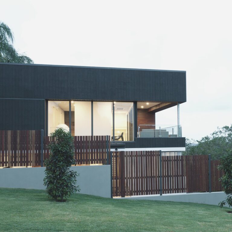 Cosy and energy efficient house with warm white lights and brown fence